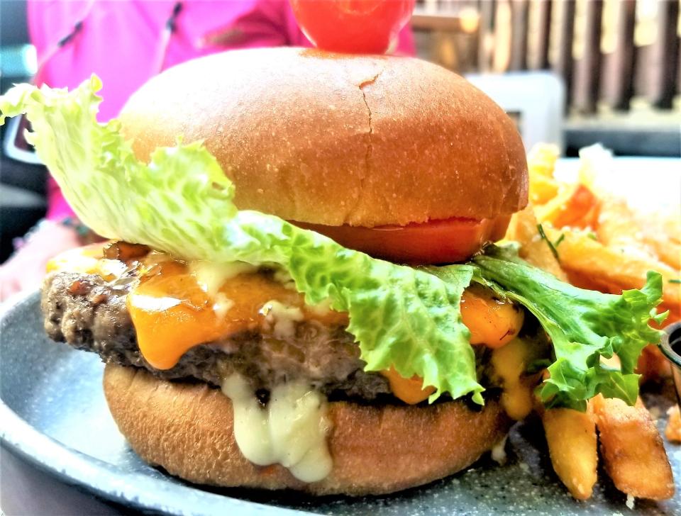 The Billionaire Burger with truffle fries at The Cottage in Siesta Key Village photographed May 6, 2023.