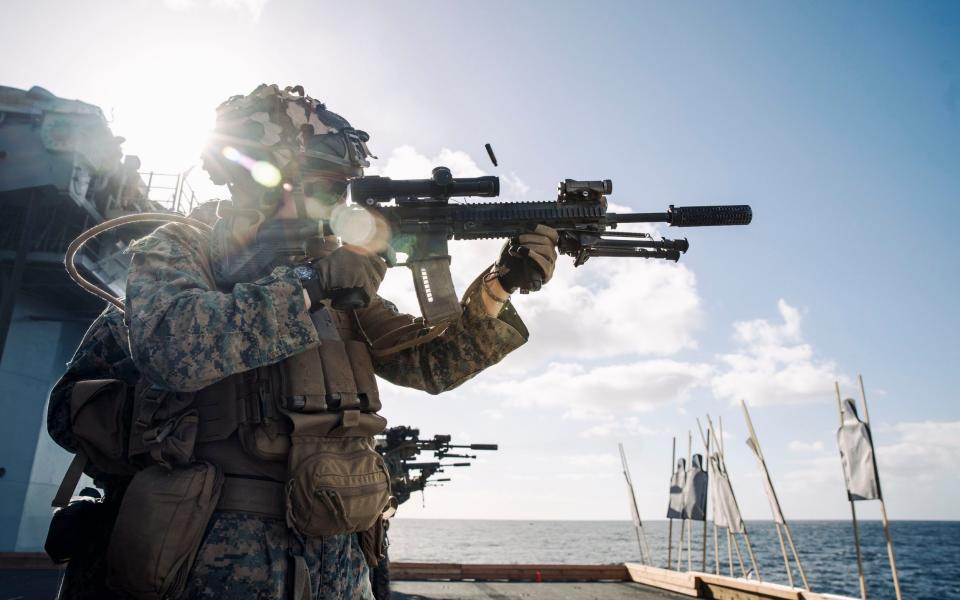 The US Marines appeared to mock the US Navy by posting a similar image on their Instagram account, but with the rifle properly held and fired.