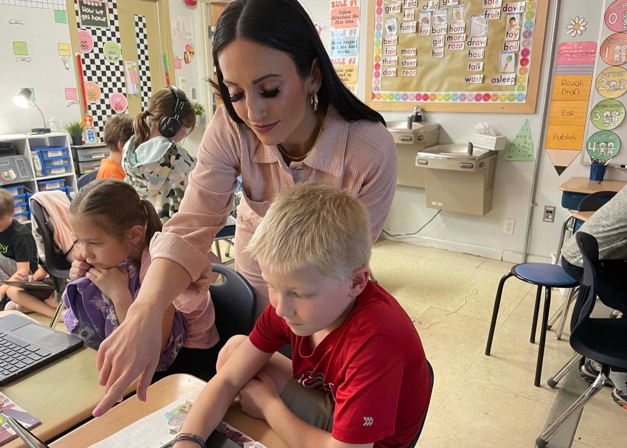 Second grade teacher MacKenzie Deising helps Lucy Lloyd and David Kabela with the lesson of the day at Hardin Valley Elementary School on Feb. 28. 2024.