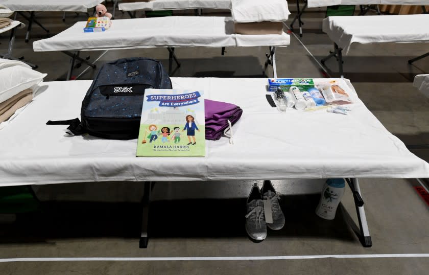 LONG BEACH, CA - APRIL 22: Sleeping quarters set up inside Exhibit Hall B for migrant children are shown during a tour of the Long Beach Convention Center on April 22, 2021 in in Long Beach, California. Long Beach officials and officials with the U.S. Department of Health and Human Services led the tour. Migrant children found at the border without a parent were scheduled to be temporarily housed at the facility beginning today. Officials say the center can accommodate up to 1,000 children. (Photo by Brittany Murray-Pool/Getty Images
