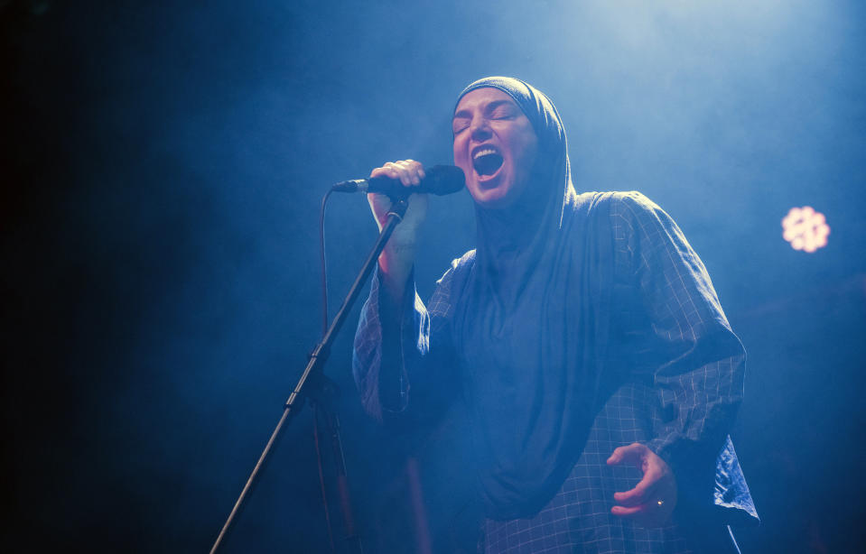 FILE - Irish singer Sinead O'Connor performs at Akvarium Klub in Budapest, Hungary, Dec. 9, 2019. O’Connor, the gifted Irish singer-songwriter who became a superstar in her mid-20s but was known as much for her private struggles and provocative actions as for her fierce and expressive music, has died at 56. The singer's family issued a statement reported Wednesday by the BBC and RTE. (Marton Monus/MTI via AP, File)