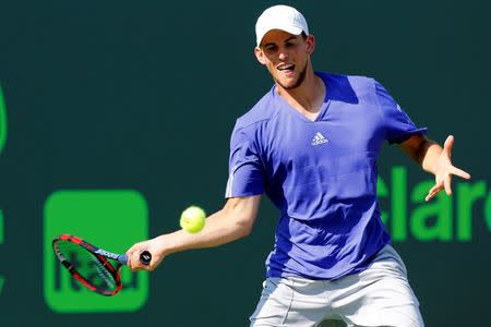 Apr 1, 2015; Key Biscayne, FL, USA; Dominic Thiem hits a forehand against Andy Murray (not pictured) on day ten of the Miami Open at Crandon Park Tennis Center. Murray won 3-6, 6-4, 6-1. Mandatory Credit: Geoff Burke-USA TODAY Sports