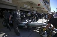 Formula One F1 - U.S. Grand Prix - Circuit of the Americas, Austin, Texas, U.S., 22/10/16. Mercedes' Lewis Hamilton of Britain sits in his car as his crew moves him arond the garage area during the third practice session. REUTERS/Adrees Latif