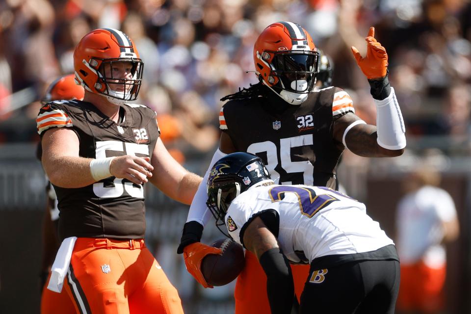 Browns tight end David Njoku, right, signals for a first down during the first half against the Ravens, Sunday, Oct. 1, 2023, in Cleveland.