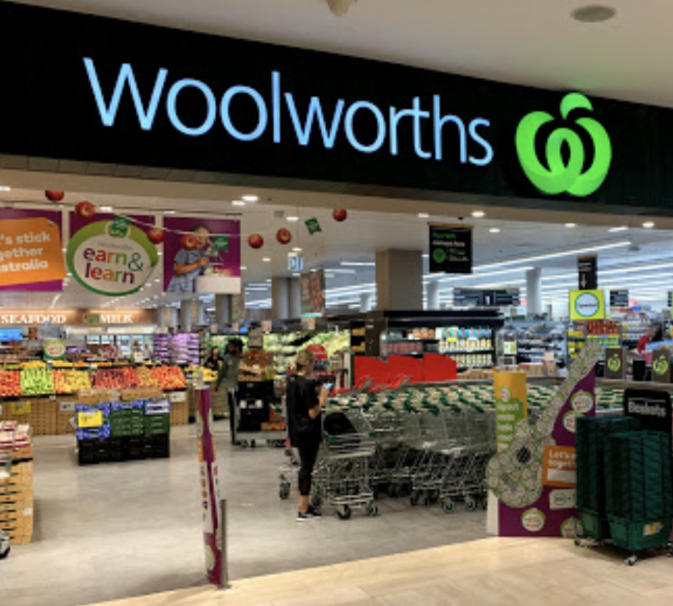 Photo shows the front of a Woolworths store. 