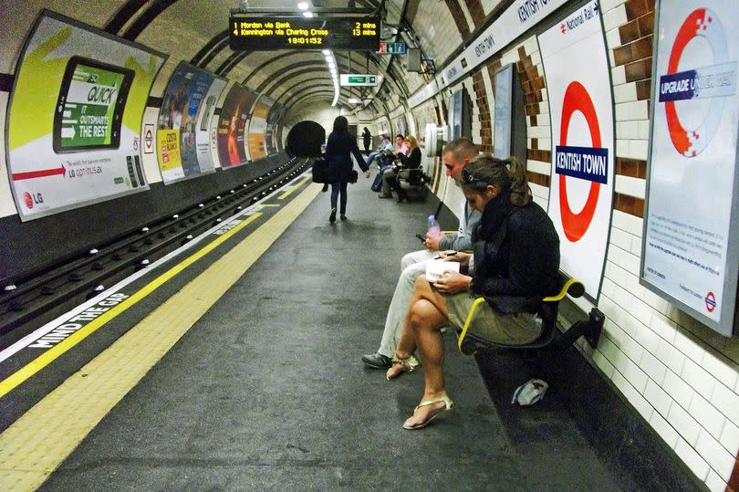 Customers on a platform at Kentish Town Tube station