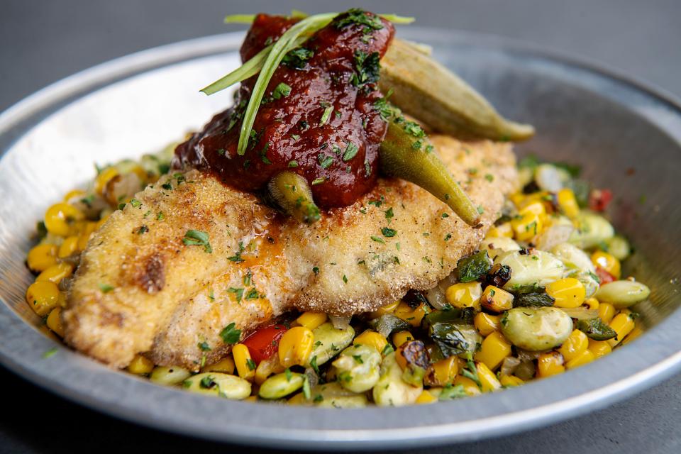 Salt Face Mule’s Cornmeal Dusted Catfish is served with sweet corn and lima bean succotash, tomato jam and pickled okra.