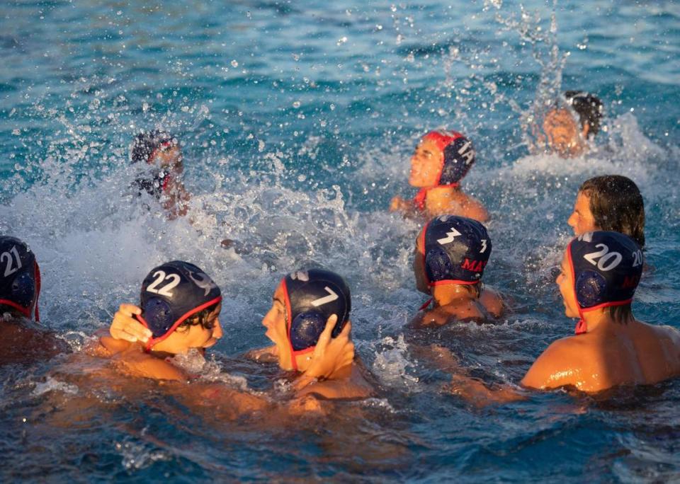 MAST players celebrate their win after the GMAC boys water polo finals against Columbus on Wednesday, March 20, 2024, at MAST Academy on Virginia Key. Alie Skowronski/askowronski@miamiherald.com