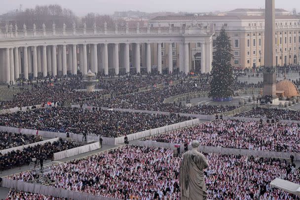 PHOTO: Faithful attend the funeral mass for late Pope Emeritus Benedict XVI in St. Peter's Square at the Vatican, Thursday, Jan. 5, 2023. (Ben Curtis/AP)