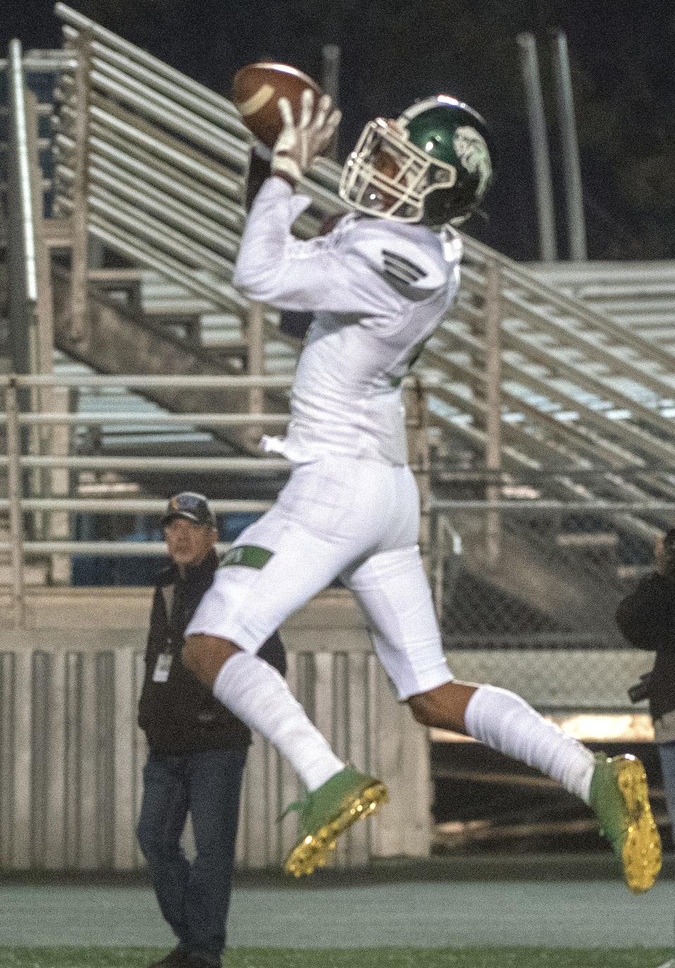 Manteca's Zion Allen makes the game winning catch during the Sac-Joaquin Section Division III championship game against Oakdale at St. Mary's High School in Stockton. Manteca won 35-28.