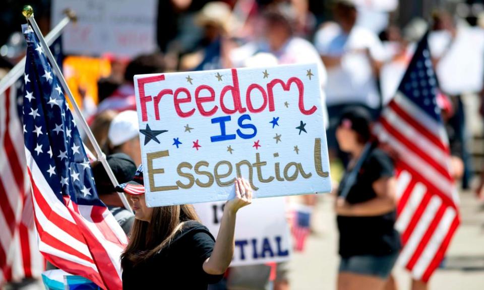 People gather to protest the stay-at-home orders outside the state capitol building in Sacramento, California, this month.