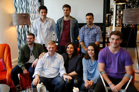 New Zealand Prime Minister Bill English (front row, 2nd L) and his wife Mary (front row, C) sit with their children on general election day in Auckland, New Zealand, September 23, 2017. REUTERS/Nigel Marple