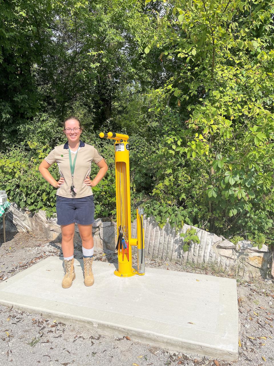 Kailey Bostick next to her Girl Scouts Gold Star project, a bike repair stand at Ijams Nature Center, on Aug. 15, 2022.