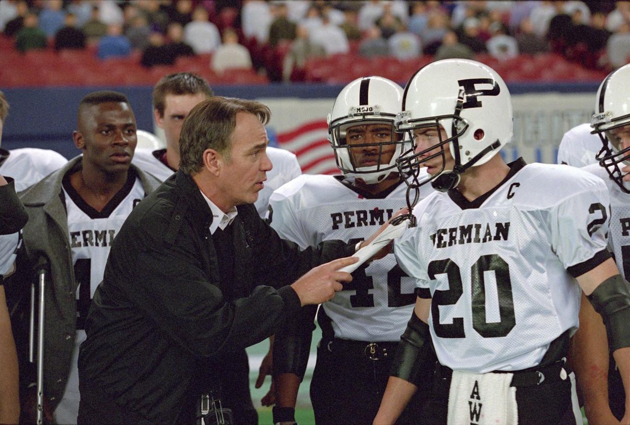 Boobie Miles (Derek Luke), Coach Gary Gaines (Billy Bob Thornton), Chris Comer (Lee Thompson Young) and Mike Winchell (Lucas Black) on the sidelines in "Friday Night Lights." 