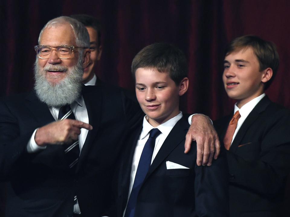 David Letterman puts his arm around his son Harry.