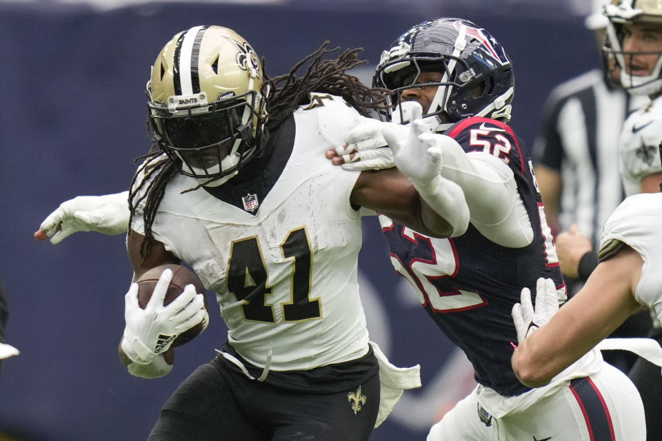 New Orleans Saints running back Alvin Kamara (41) carries against Houston Texans defensive end Jonathan Greenard (52) in the second half of an NFL football game against the Houston Texans in Houston, Sunday, Oct. 15, 2023. (AP Photo/Eric Christian Smith)