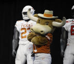 Texas mascot Hook'em poses on stage with team uniforms on the first day of Big 12 Conference NCAA college football media days Monday, July 15, 2019, at AT&T Stadium in Arlington, Texas. (AP Photo/David Kent)