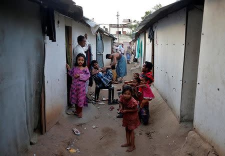 People belonging to Rohingya Muslim community sit outside their makeshift houses on the outskirts of Jammu, May 5, 2017. REUTERS/Mukesh Gupta/Files