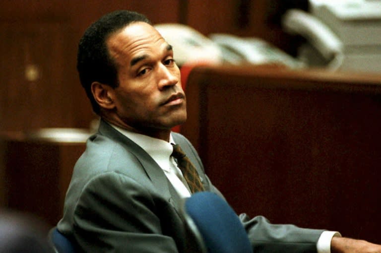 On trial, O.J. Simpson's spectacular sports career came crashing down when he was accused of murdering his ex-wife and her friend (POOL)