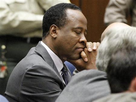 Dr. Conrad Murray closes his eyes after he was sentenced to four years in county jail for his involuntary manslaughter conviction of pop star Michael Jackson in Los Angeles November 29, 2011. REUTERS/Mario Anzuoni