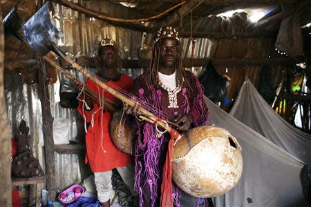 Traditional Donso musicians pose for a picture at their house in Bamako February 27, 2014. REUTERS/Joe Penney