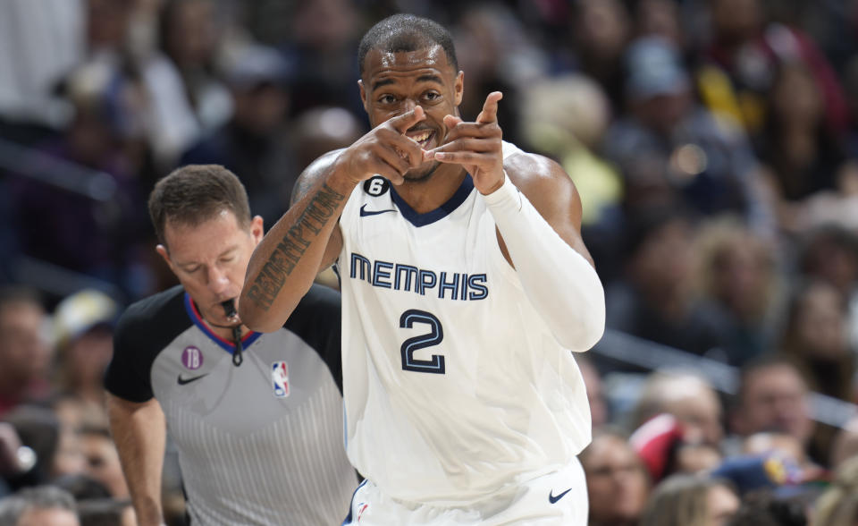 Memphis Grizzlies forward Xavier Tillman (2) gestures to the bench after hitting a 3-point basket against the Denver Nuggets in the first half of an NBA basketball game Friday, March 3, 2023, in Denver. (AP Photo/David Zalubowski)