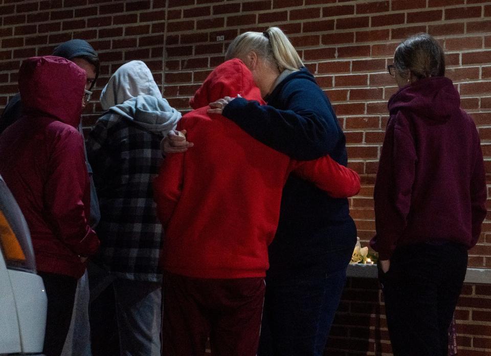 The mother and family of Peter Romano lit candles and hugged one another at the scene where he was fatally shot at 2636 Bristol Pike in Bensalem on Wednesday, Nov. 1, 2023. 

[Daniella Heminghaus | Bucks County Courier Times]