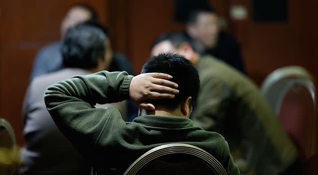 Family members of passengers from the missing Malaysia Airlines flight MH370 wait for news at the Lido Hotel. Photo: Getty Images