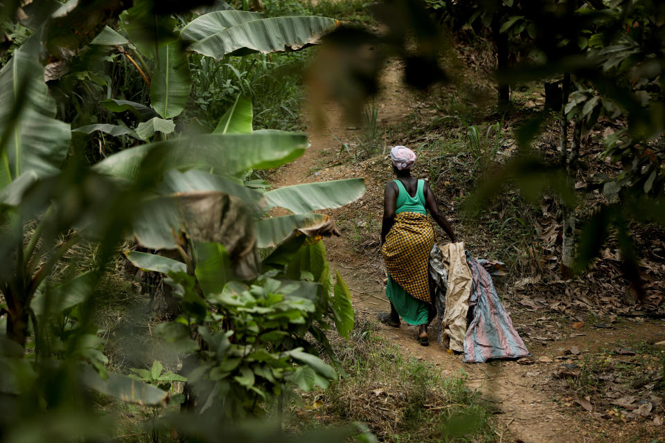 A woman walks trough the bushes in Prestea, a mining town in southwest Ghana. (Photo: Siphiwe Sibeko/Reuters)