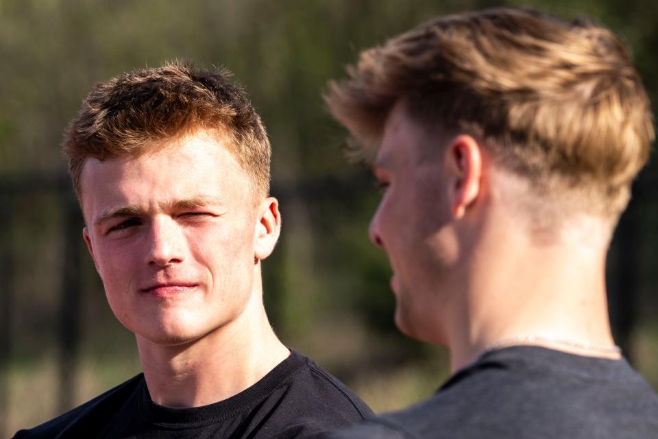 Iowa football commit Brevin Doll listens as Iowa State football commit Aiden Flora speaks during an interview Wednesday at ADM High School in Adel.
