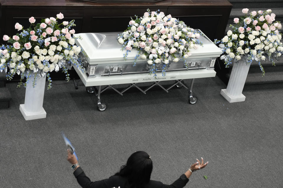 A mourner attends the funeral for Michigan State University shooting victim Arielle Anderson in Detroit, Tuesday, Feb. 21, 2023. Anderson, Alexandria Verner and Brian Fraser and were killed and several other students injured after a gunman opened fire on the campus of Michigan State University. (AP Photo/Paul Sancya)