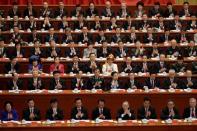 Delegates clap as Chinese President Xi Jinping delivers his speech during the opening of the 19th National Congress of the Communist Party of China at the Great Hall of the People in Beijing, China October 18, 2017. REUTERS/Jason Lee