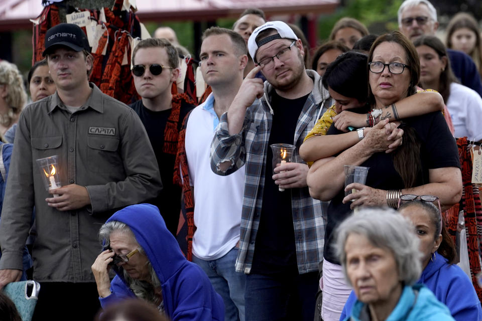 Residents from around the Highland Park, Ill., area listen during a vigil in Highwood, Ill., for the victims of Monday's Highland Park Fourth of July parade mass shooting, Wednesday, July 6, 2022. (AP Photo/Charles Rex Arbogast)