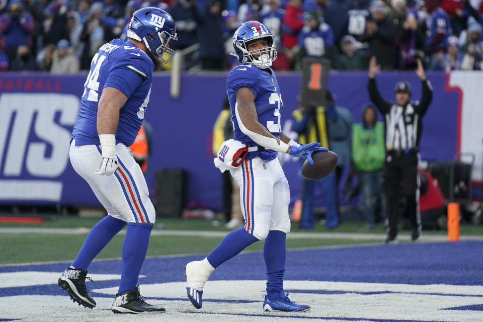 New York Giants running back Matt Breida (31) runs in a touchdown during the second half of an NFL football game against the Detroit Lions, Sunday, Nov. 20, 2022, in East Rutherford, N.J. (AP Photo/Seth Wenig)