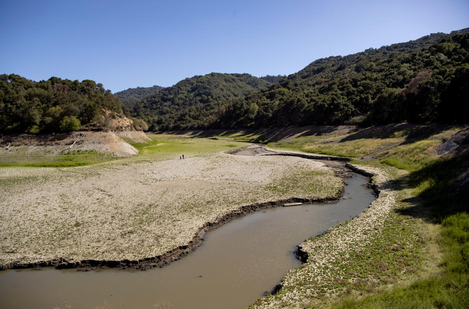 An aerial view shows drought-stricken Stevens Creek Reservoir, currently at 18% capacity, in Cupertino, Calif., Thursday, May 20, 2021. California Gov. Gavin Newsom declared a drought emergency for most of the state. (AP Photo/Josh Edelson)