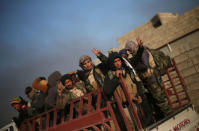 Iraqi forces backed by tribal militias during battle to retake a village from the Islamic State on the eastern bank of the river Tigris, Iraq December 7, 2016. REUTERS/Mohammed Salem