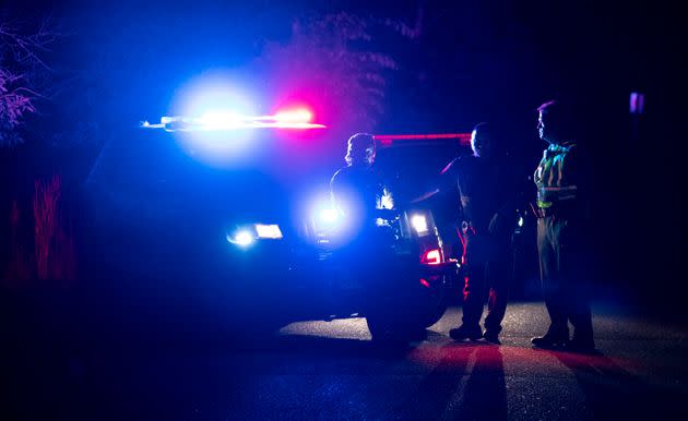 Police set up a perimeter at Vadnais Lake on Friday. (Photo: Alex Kormann/Star Tribune via AP)