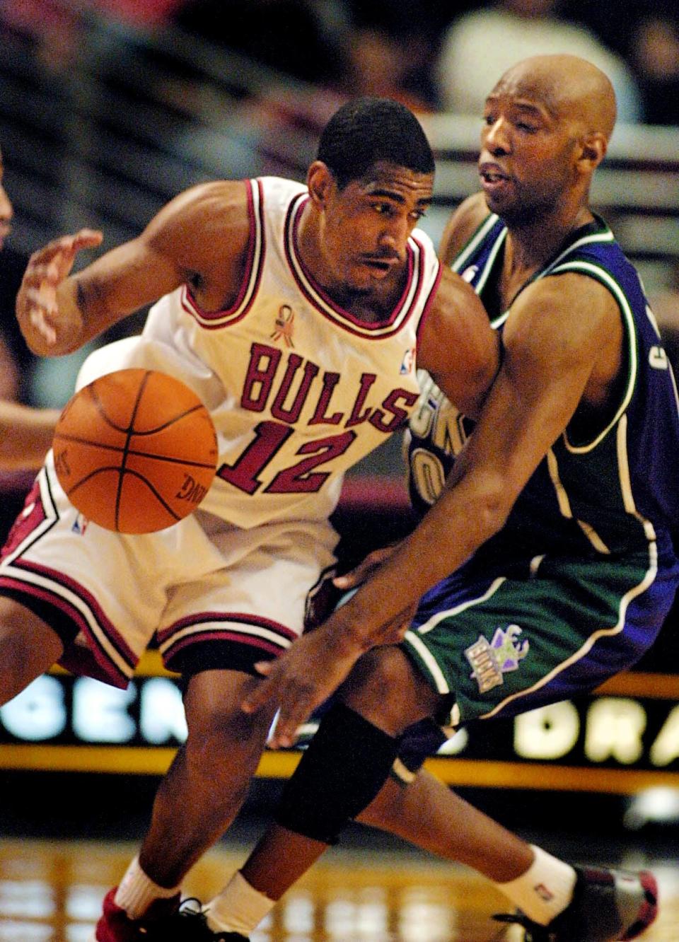 Chicago Bulls guard Kevin Ollie has the ball poked loose by Milwaukee Bucks guard Sam Cassell in the first quarter Feb. 12, 2002 at the United Center in Chicago.