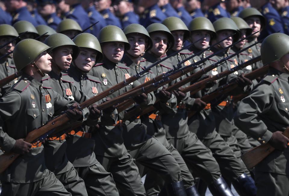 Russian soldiers dressed in Red Army World War II uniforms march toward Red Square during the Victory Day military parade marking the 75th anniversary of the Nazi defeat in Moscow, Russia, Wednesday, June 24, 2020. The Victory Day parade normally is held on May 9, the nation's most important secular holiday, but this year it was postponed due to the coronavirus pandemic. (AP Photo/Pavel Golovkin, Pool)