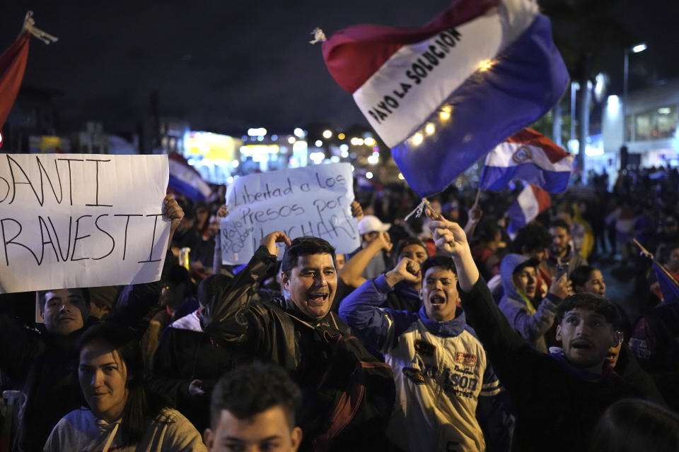 Supporters of National Crusade Party presidential candidate, Paraguayo Cubas, protest outside the Electoral Tribunal building, in Asuncion, Paraguay, Friday, May 5, 2023. Police on Friday detained Cubas, a far-right populist who came in third in Sunday’s presidential election and had alleged without evidence the vote was marred by fraud. (AP Photo/Jorge Saenz)