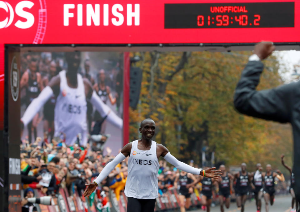 Kenya's Eliud Kipchoge, the marathon world record holder, crosses the finish line during his attempt to run a marathon in under two hours in Vienna, Austria, October 12, 2019. REUTERS/Leonhard Foeger