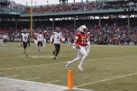 Louisville's Jawhar Jordan, right, runs past Cincinnati's Ja'von Hicks (3) for a touchdown during the first quarter of the Fenway Bowl NCAA college football game at Fenway Park Saturday, Dec. 17, 2022, in Boston. (AP Photo/Winslow Townson)