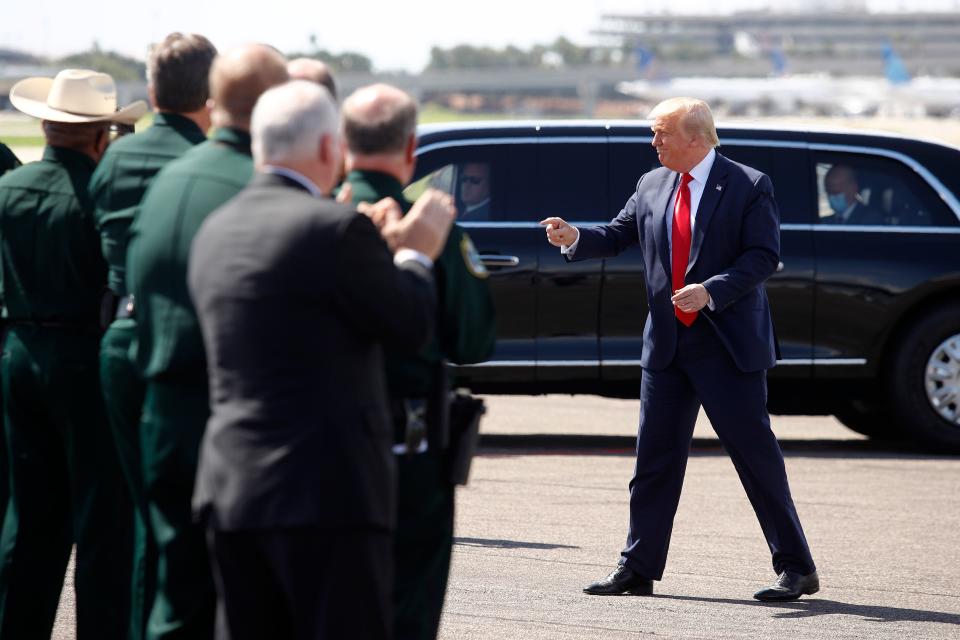 President Donald Trump arrives at a campaign event with Florida sheriffs in Tampa on July 31.