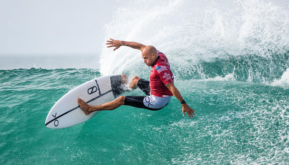 Champion Kelly Slater, with a traditionally-female first name, surfs at Jeffreys Bay, South Africa.