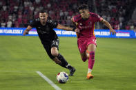 St. Louis City's Celio Pompeu, right, chases after a loose ball as Houston Dynamo's Daniel Steres defends during the second half of an MLS soccer match Saturday, June 3, 2023, in St. Louis. (AP Photo/Jeff Roberson)