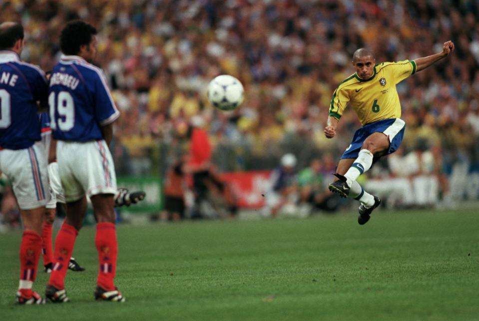 Roberto Carlos curls his free-kick around the France wall (Credit: Getty Images)