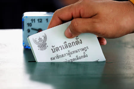 A voter casts their ballot for the general election at a polling station in Bangkok, Thailand, March 24, 2019. REUTERS/Athit Perawongmetha