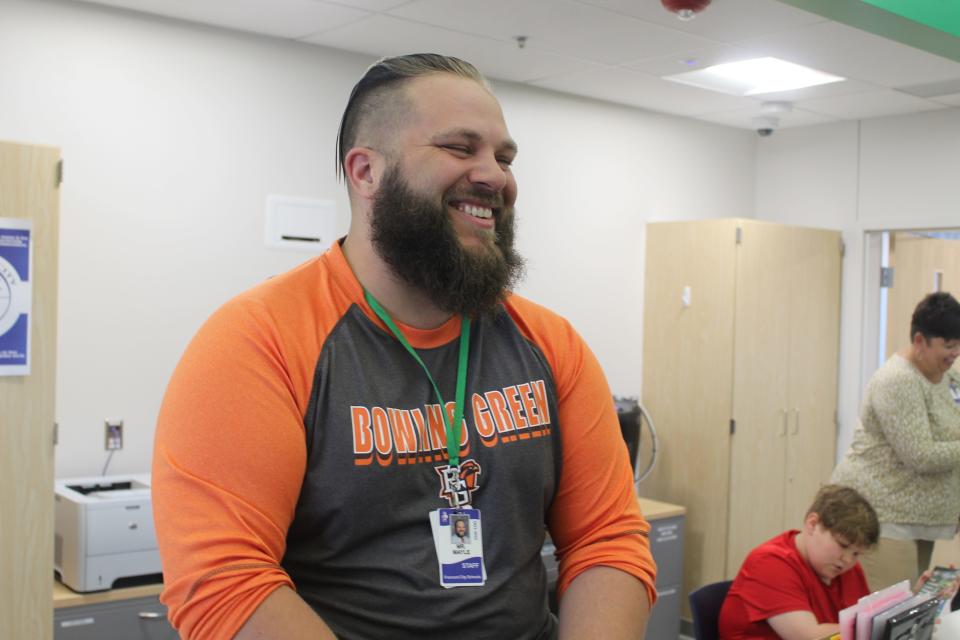 Croghan Elementary School third grade teacher Nikolaos Mayle greets students and staff with a Southern accent Thursday at the school's main office as one of the challenges the school came up with during Teacher Appreciation Week.