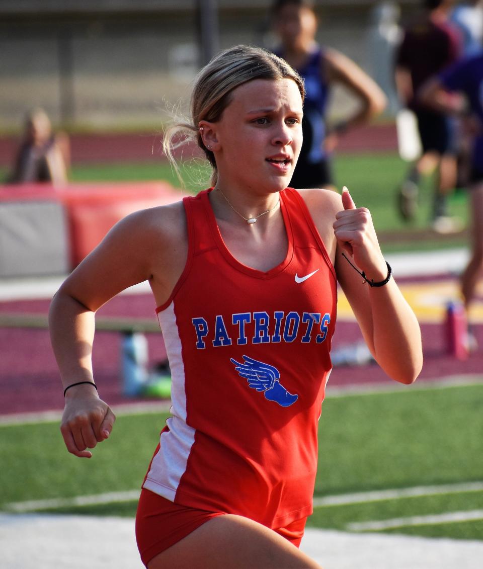 Owen Valley's Natalie Young runs the 400-meter dash at the Bloomington North sectional on May 17, 2022.