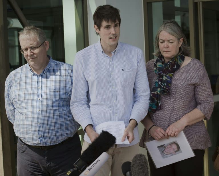 Sue Miller, Ian Miller and Michael Miller (C) -- the parents and brother of slain British tourist David Miller -- make a brief statement to the media after the murder trial verdict at the Koh Samui Provincial Court on December 24, 2015